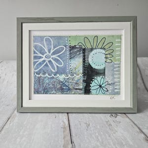 small mixed media collage with stitch detail