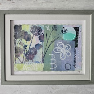 small mixed media collage with stitch detail