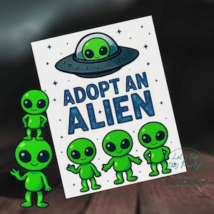May include: A white card with the text "ADOPT AN ALIEN" in blue, featuring a cartoon spaceship and green aliens. Three small green aliens are at the bottom, with two stacked on the left. The image has a playful, whimsical theme.