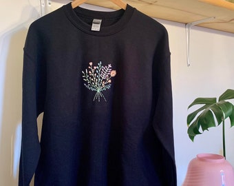 Flower bouquet embroidery on black sweater