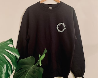 Black crewneck with embroidered flower crown