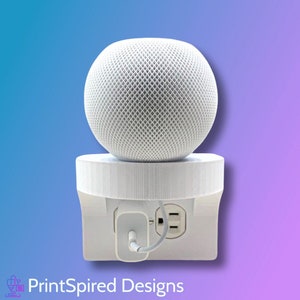 May include: White 3D printed wall mount for a smart speaker with a white power cord plugged into a standard outlet.