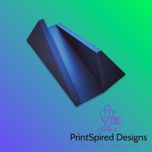May include: A dark blue 3D printed phone stand with a triangular shape. The stand is designed to hold a phone upright.