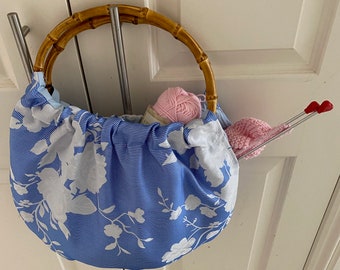 Blue Knitters Bag   with white roses and real bamboo handles, lining  and inside pocket