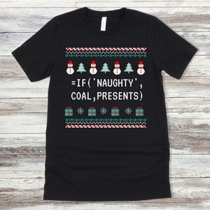 May include: Black t-shirt featuring a Christmas-themed design. The design includes pixelated snowmen, Christmas trees, and gift boxes, along with the text "=IF ('NAUGHTY', COAL, PRESENTS)". The shirt has a crew neck and short sleeves.