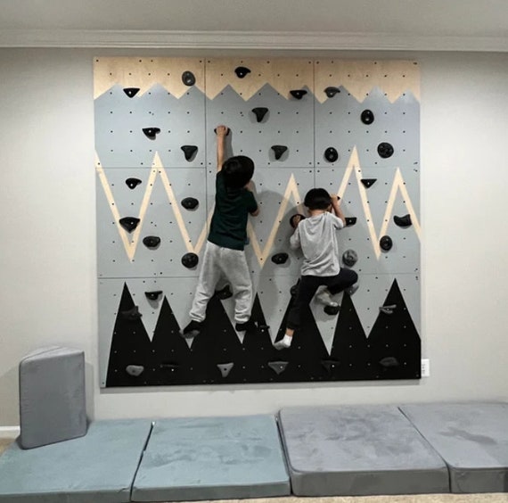 Mountain climbers on wall hotsell