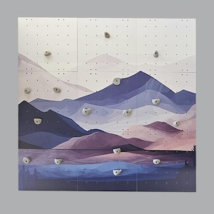 Mountain landscape with blue background, wooden wall for kids with climbing stones, painted climbing wall, kletterwand