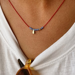 Red string necklace