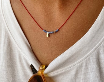 Red string necklace