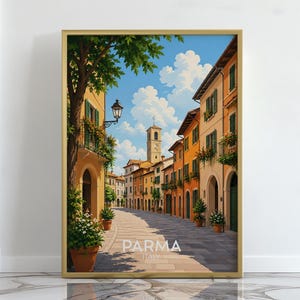 May include: A framed wall art print depicting a sunlit street in Parma, Italy, featuring orange and yellow buildings, green shutters, potted plants, a stone pathway, and a clock tower under a blue sky with white clouds, with the text PARMA ITALY.