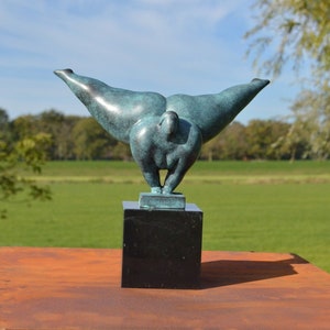 Bronze sculpture of a voluminous lady in handstand position (green patina)