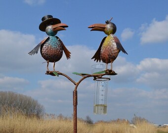 Rain gauge adorned with 2 Colored Ravens