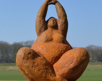 Cast iron garden statue of a voluminous lady in yoga pose