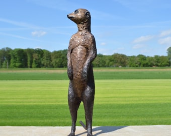 Bronze sculpture of a standing meerkat