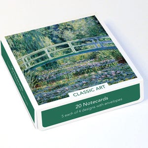 May include: A square box of 20 notecards featuring a reproduction of Claude Monet's water lily pond painting on the lid. The dark green sides of the box display the text CLASSIC ART, 20 Notecards, and 5 each of 4 designs with envelopes.