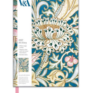 May include: A 2027 A5 diary featuring a blue cover with a large white, pink, and gold floral pattern. A white vertical band on the left displays the V&A logo, the text 2027 A5 Diary, and details about the ribbon marker, week to view, and notable dates.