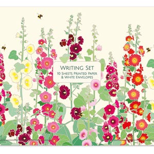 May include: A writing set featuring a cream background with a vibrant illustration of tall hollyhock flowers in shades of red, pink, and yellow, accompanied by small bees. The centre text reads: WRITING SET 10 SHEETS PRINTED PAPER & WHITE ENVELOPES.