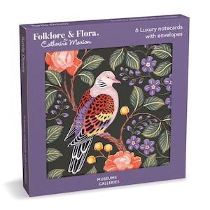 May include: A purple box containing 6 luxury notecards with envelopes, titled Folklore & Flora by Catherine Marion. The box features a turtle dove illustration on a black background with orange flowers, purple blossoms, and green leaves.