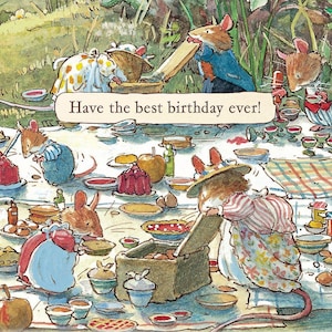 May include: A watercolour illustration of anthropomorphic mice at a picnic with the text Have the best birthday ever! The scene features mice in clothing gathered around a table filled with various food items, plates, and cups on a chequered cloth.
