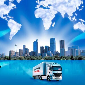 May include: A graphic illustration of global shipping and logistics with a city skyline in the background.  A train, truck, airplane, and cargo ship are shown traveling to and from the city. The text "NATOS GROUP" is visible on the side of the truck.