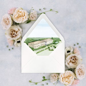 May include: A white envelope with a watercolor illustration of a building with a green lawn and trees. The building is a light brown color with white trim. The lawn is surrounded by a stone wall.