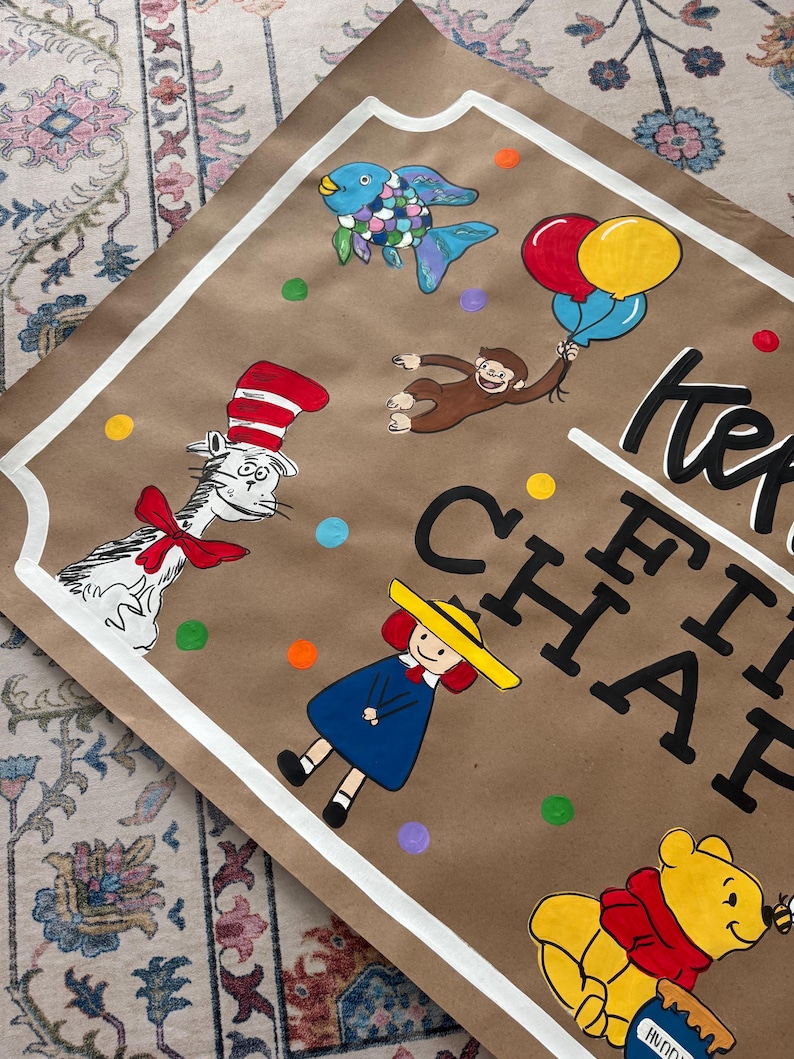 May include: Hand-painted artwork on brown paper featuring cartoon characters like The Cat in the Hat, Curious George, and Winnie the Pooh. The artwork includes colorful balloons, fish, and the text "Keep the Happy".