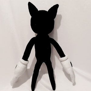 May include: A black plush toy with white gloves. The toy has a cartoon-like appearance with large ears and a slender body.