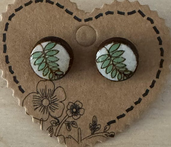 Stud Earrings Featuring a Fern-Like Plant