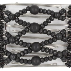 May include: A hair comb featuring a series of silver-toned metal wires arranged in a rectangular frame. The design includes black wooden beads and smaller black seed beads woven throughout the structure, creating a textured, grid-like pattern.