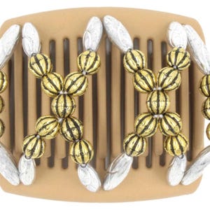 May include: A brown plastic hair comb with gold and silver beads. The beads are arranged in a decorative pattern.