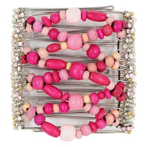 May include: A hair comb featuring a series of silver metal teeth connected by elastic cords. The cords are decorated with a variety of wooden beads in shades of hot pink, light pink, and pale peach, with small clear and silver beads on the edges.