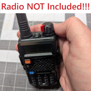 May include: A black two-way radio with a red knob and a black antenna. The radio has a small screen and a keypad. The text "Radio NOT Included!!!" is displayed above the radio.