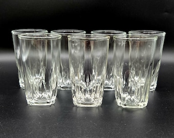 Vintage Four Ounce Clear Juice Glasses with a Gum Drop Shaped Fan Design around a Square Base - Set of Seven Glasses