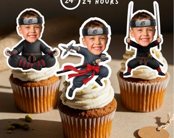 May include: Three cupcakes topped with white frosting and ninja-themed toppers. The toppers feature a child's face in various ninja poses, holding weapons. The image includes the text "READY IN 24 HOURS".