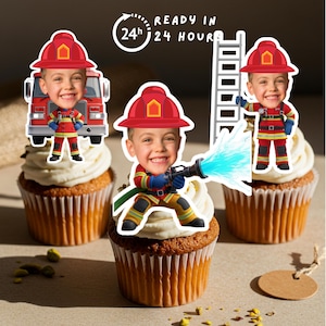 May include: Three cupcakes with white icing, each decorated with a firefighter-themed cutout of a child. The cutouts show a fire engine, a ladder, and a child spraying water. The text "READY IN 24 HOURS" is also visible.