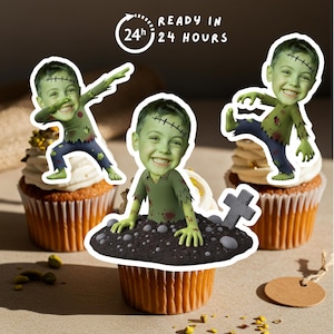 May include: Three Halloween-themed cupcakes with cartoon zombie toppers. The zombies are green with stitches and torn clothing. The cupcakes have white frosting and are on a light brown surface. Text on the image reads "READY IN 24 HOURS."