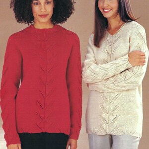 May include: A long-sleeved red jumper with a crew neckline and a vertical eyelet lace pattern, paired with a long-sleeved cream-coloured jumper featuring a V-neckline and a matching vertical eyelet lace design on the front and sleeves.