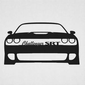 May include: Black silhouette of a Dodge Challenger SRT car. The image shows the front of the car with the headlights, hood scoop, and the text "Challenger SRT" across the front.