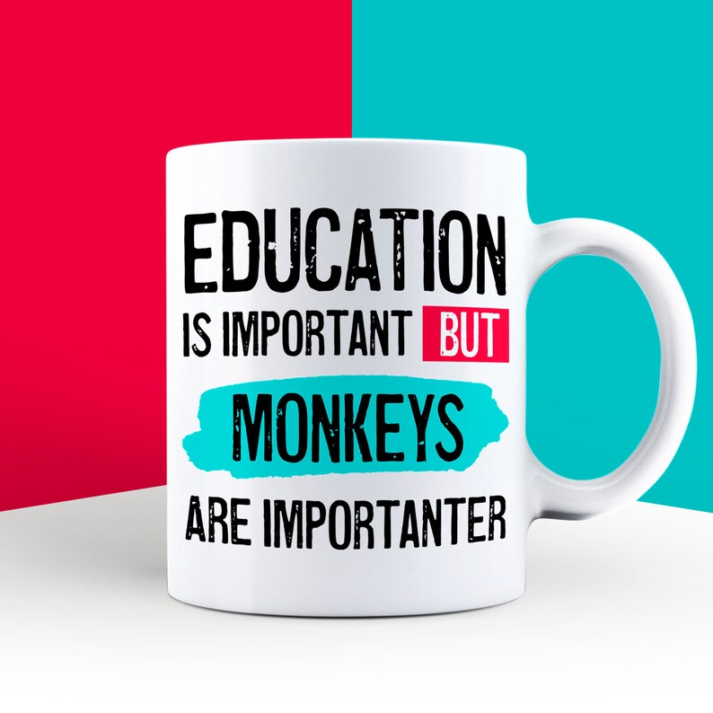 May include: White ceramic coffee mug with black text that reads "Education is important but monkeys are importanter". The text "but" is in red and the text "monkeys" is in a turquoise blue.
