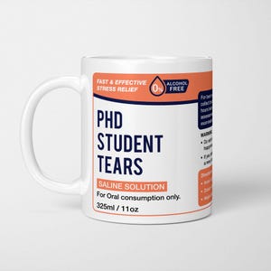 May include: A white ceramic mug featuring a label design that mimics a medicine bottle. The text reads PHD STUDENT TEARS, SALINE SOLUTION, For Oral consumption only, 325ml / 11oz, FAST & EFFECTIVE STRESS RELIEF, and 0% ALCOHOL FREE.