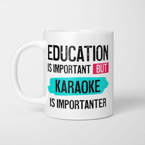 May include: A white ceramic mug featuring black text that reads EDUCATION IS IMPORTANT BUT in black, with the word BUT highlighted in a pink rectangle, followed by KARAOKE in black on a teal brush stroke, and IS IMPORTANTER in black text below.