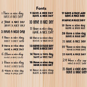 May include: A wooden background displays 25 different font styles of the phrase "Have a nice day." Each style is presented twice, once in a larger, more decorative font and again in a smaller, simpler font.