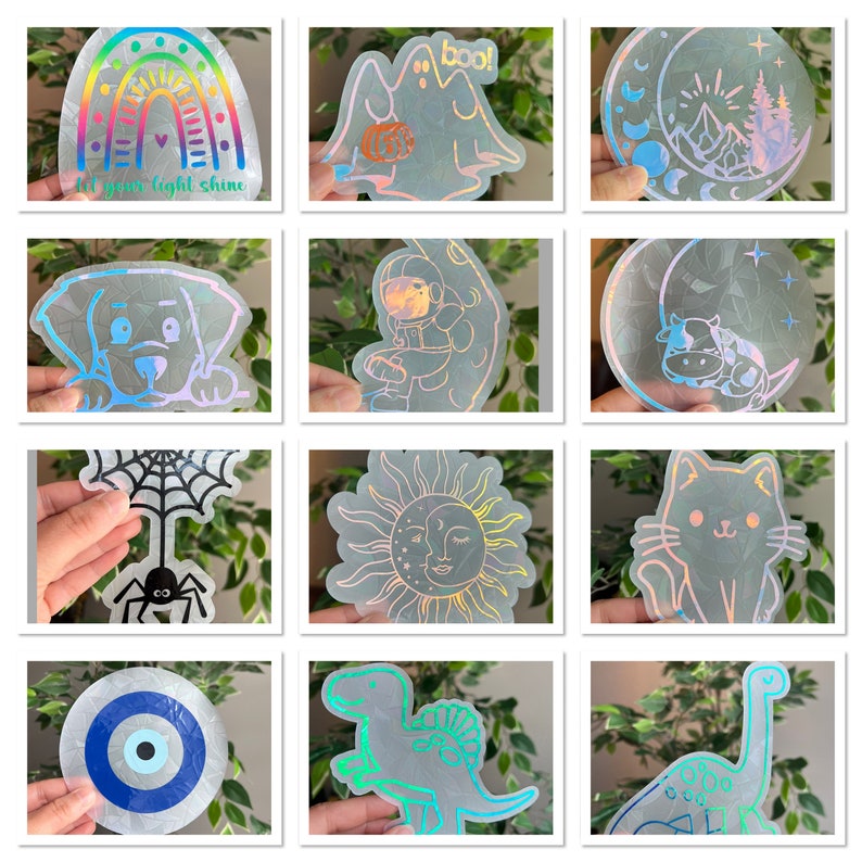 May include: A set of 10 iridescent holographic stickers featuring various designs, including a rainbow, a ghost, a moon, a sun, a spider, a dinosaur, an evil eye, a cat, a dog, and an astronaut.  The stickers are printed on clear vinyl and have a holographic finish.