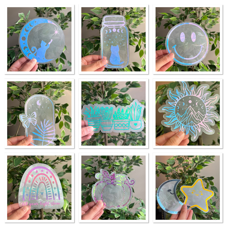 May include: A set of nine iridescent holographic stickers featuring various designs, including a crescent moon, a jar with a cat inside, a smiley face, a sun with mountains, a row of potted plants, a rainbow with the text "Let your light shine", a pumpkin, and a crescent moon with a star.