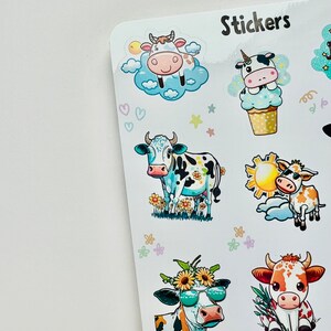 May include: Sheet of stickers featuring various cartoon cows. The stickers include cows with sunglasses, flowers, and in clouds. The word "Stickers" is printed at the top. The stickers are colorful and whimsical.