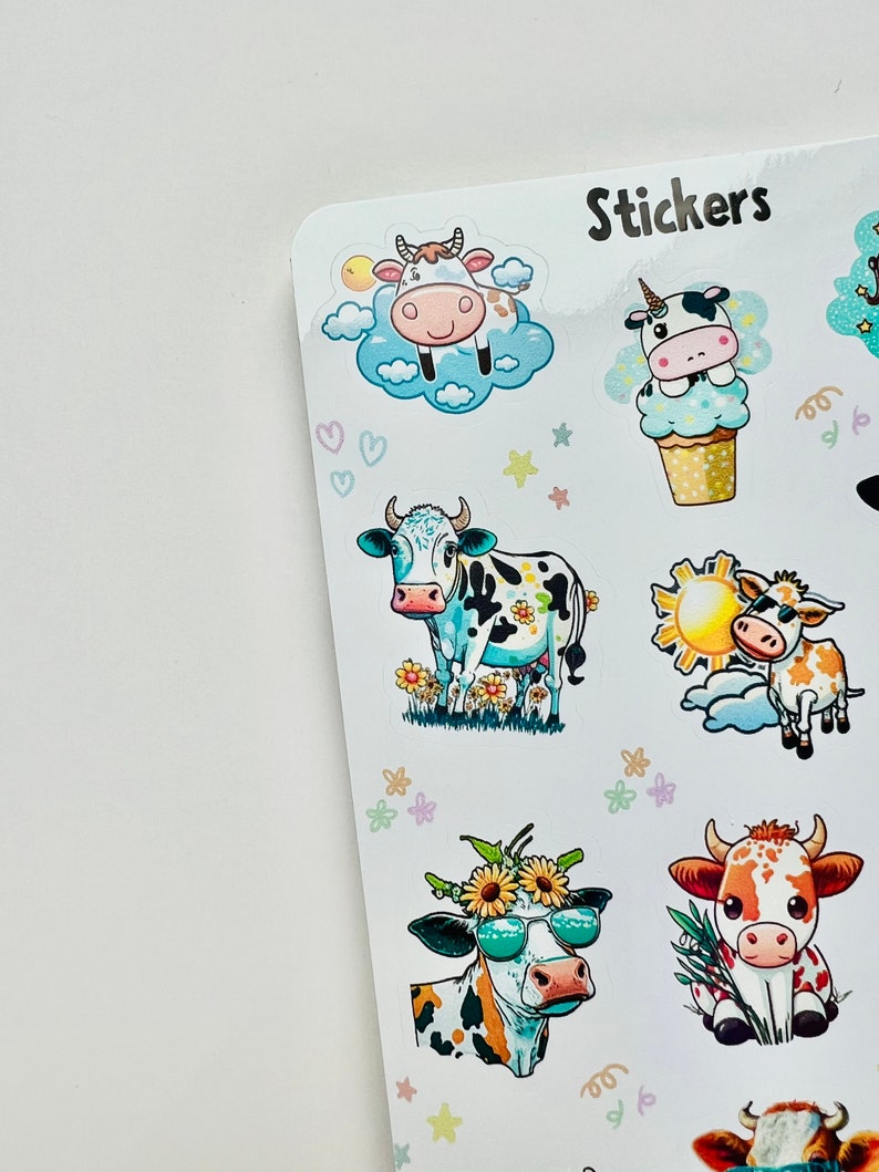May include: Sheet of stickers featuring various cartoon cows. The stickers include cows with sunglasses, flowers, and in clouds. The word "Stickers" is printed at the top. The stickers are colorful and whimsical.