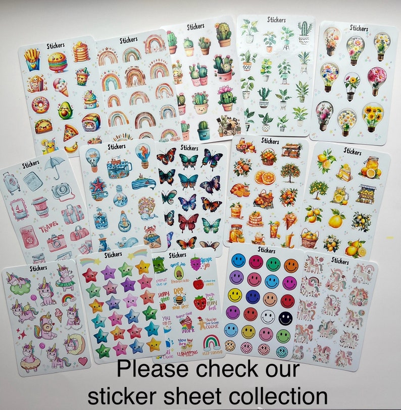May include: A collection of sticker sheets featuring various designs, including rainbows, cacti, butterflies, food items, travel-themed illustrations, and smiley faces. The text "Stickers" appears on each sheet. The bottom of the image reads "Please check our sticker sheet collection."