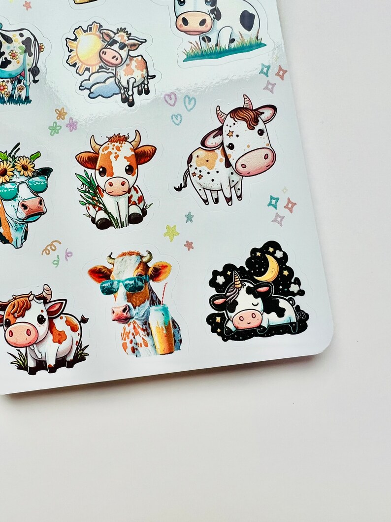 May include: A sheet of stickers featuring cartoon cows in various poses. Some cows wear sunglasses, while others are adorned with flowers or hold drinks. The stickers have a white background with colorful accents and are suitable for crafts or decorating.