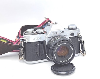 Canon AE-1 PROGRAM - ブラック - 50 mm f/1.8 レンズ付きフィルム