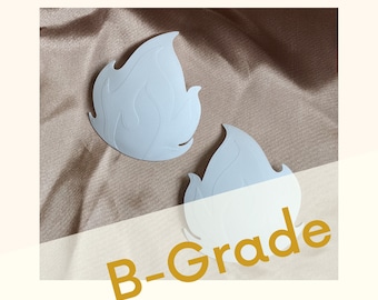 May include: Two light blue flame-shaped fabric patches with the text "B-Grade" in yellow.